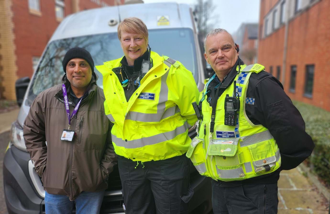 Image of FCHO colleague pictured alongside two Greater Manchester Police Officers on a Neighbourhood Walkabout