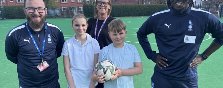 Background Image - Partnering with Oldham Athletic Community Trust (OACT) to offer free weekly football sessions for children in Derker